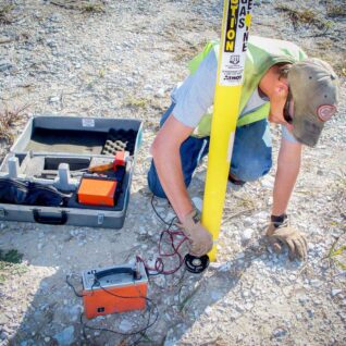 SUE crew member working on the ground for oil and gas project